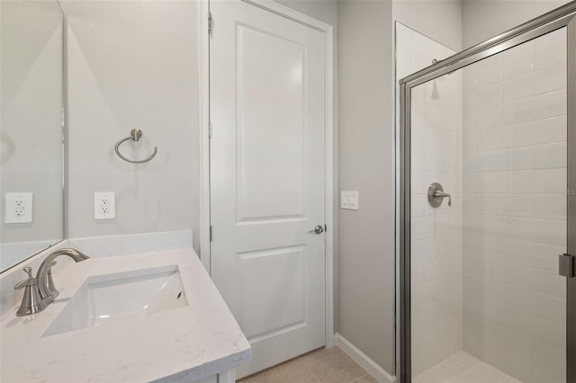 bathroom featuring tile patterned floors, vanity, and an enclosed shower