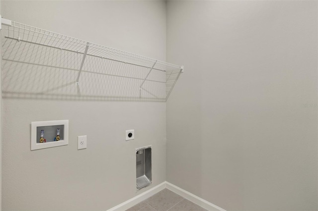 laundry room with washer hookup, electric dryer hookup, and tile patterned floors