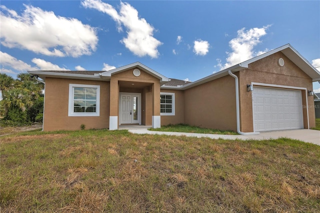 single story home with a garage and a front lawn