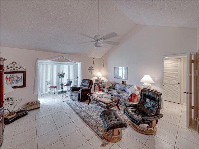 tiled living room featuring ceiling fan, high vaulted ceiling, and a textured ceiling