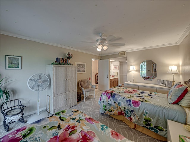 bedroom featuring crown molding, ensuite bath, ceiling fan, and light carpet