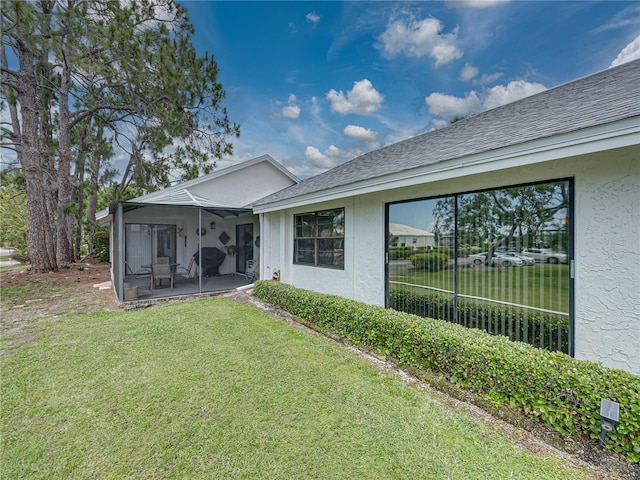 rear view of house with a lawn