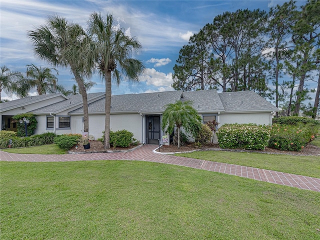 single story home featuring a front yard