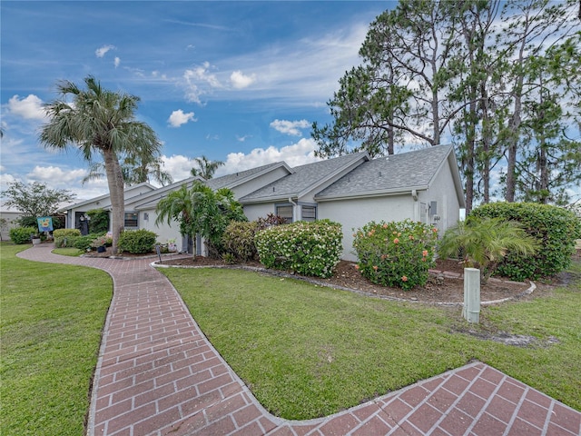 single story home with a front yard