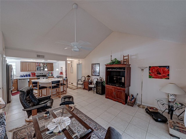 tiled living room with lofted ceiling and ceiling fan