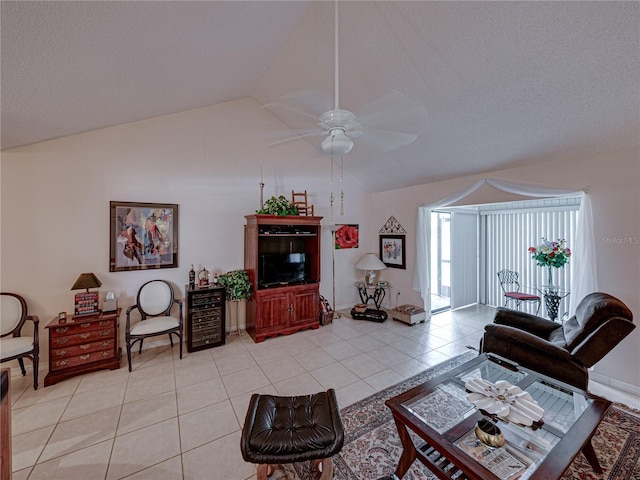 tiled living room featuring vaulted ceiling, a textured ceiling, and ceiling fan