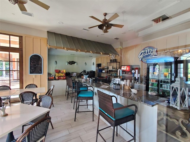 kitchen with ceiling fan and light tile floors