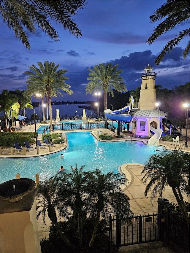 view of pool with a patio and a water slide