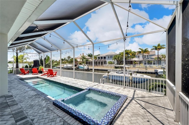 view of swimming pool with an in ground hot tub and a patio area