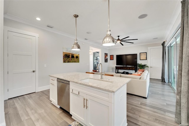 kitchen featuring an island with sink, dishwasher, light wood-type flooring, sink, and white cabinets