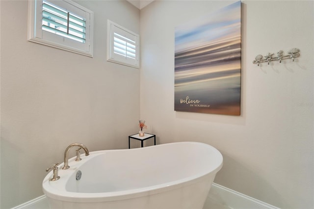 bathroom featuring a bath to relax in