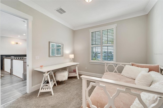 bedroom featuring light hardwood / wood-style floors and ornamental molding