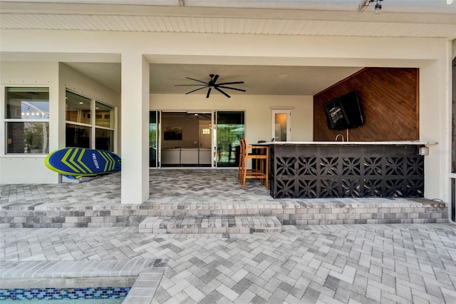 view of terrace featuring ceiling fan