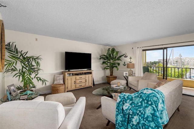 carpeted living room featuring a textured ceiling