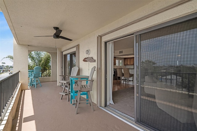 balcony featuring ceiling fan