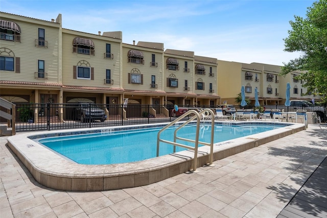 view of swimming pool with a patio