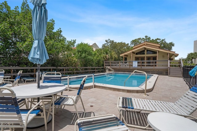 view of swimming pool featuring a patio