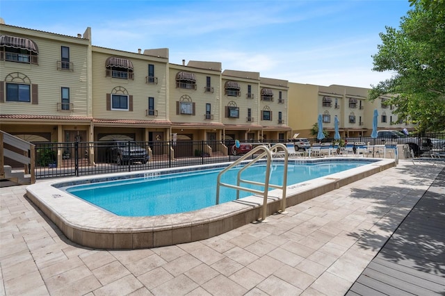 view of swimming pool featuring a patio area