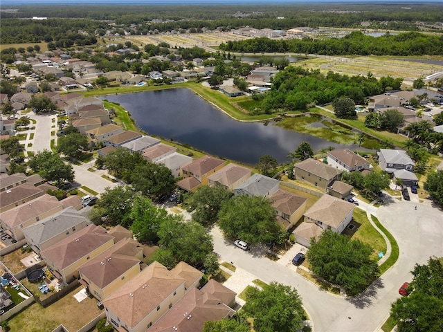 drone / aerial view featuring a water view and a residential view