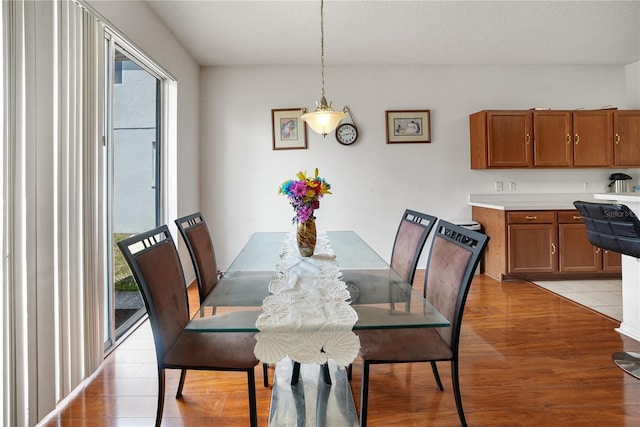 dining area featuring light wood finished floors