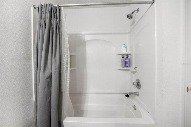 bathroom featuring shower / tub combo with curtain