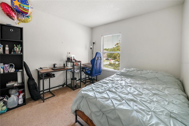 carpeted bedroom featuring a textured ceiling