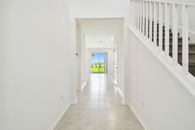 corridor featuring light tile patterned flooring