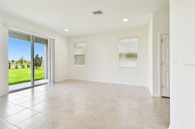 spare room featuring light tile patterned floors