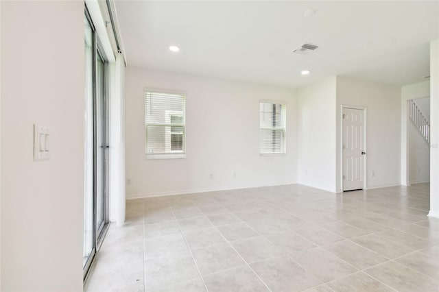 spare room with light tile patterned flooring