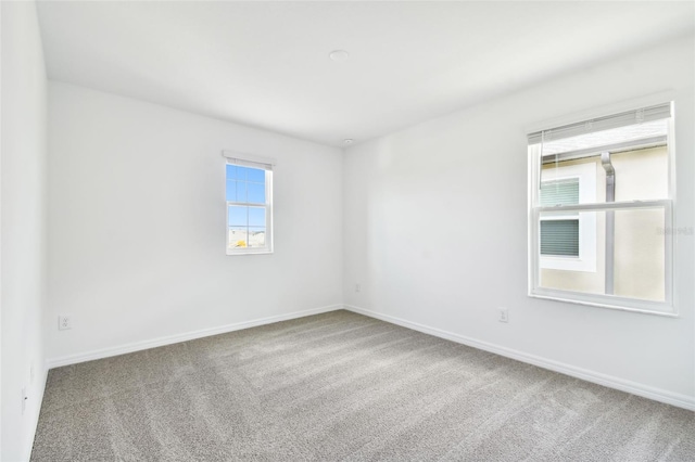 unfurnished room featuring carpet flooring