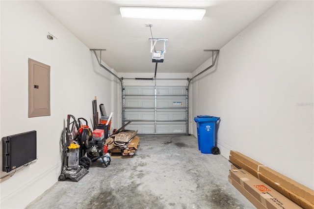 garage with electric panel and a garage door opener