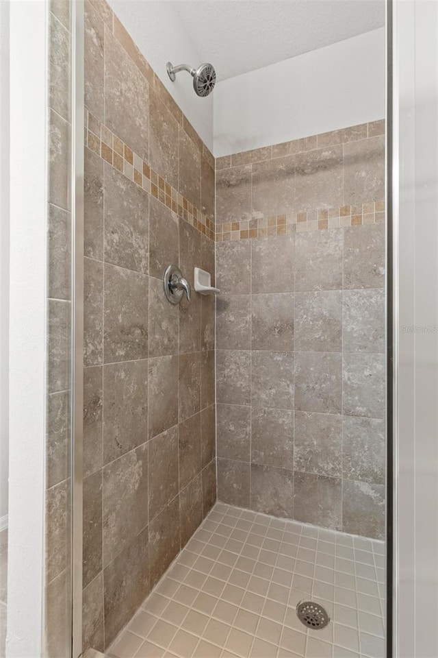 bathroom with a tile shower