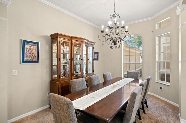 dining area with a notable chandelier, carpet flooring, and crown molding