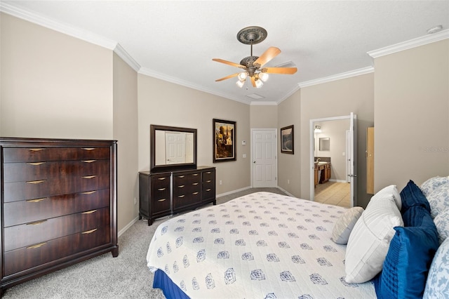 bedroom with light colored carpet, ceiling fan, ornamental molding, and ensuite bathroom