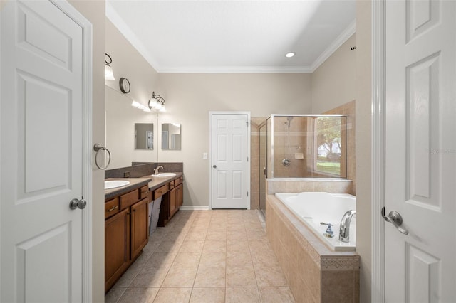 bathroom featuring ornamental molding, dual sinks, oversized vanity, and shower with separate bathtub