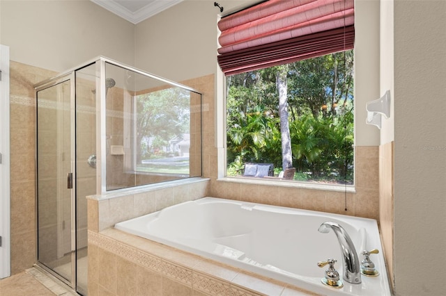 bathroom featuring crown molding and shower with separate bathtub