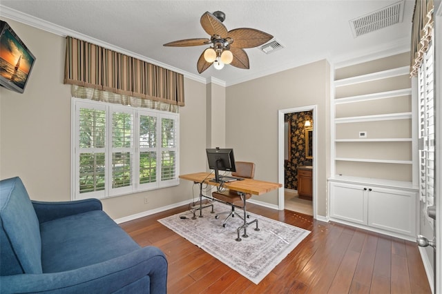 office space featuring ornamental molding, ceiling fan, dark hardwood / wood-style floors, and a textured ceiling