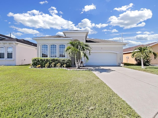 view of front of home featuring a garage and a front lawn