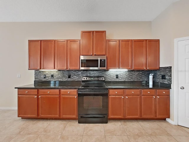 kitchen with black / electric stove, light tile patterned floors, dark stone counters, and backsplash