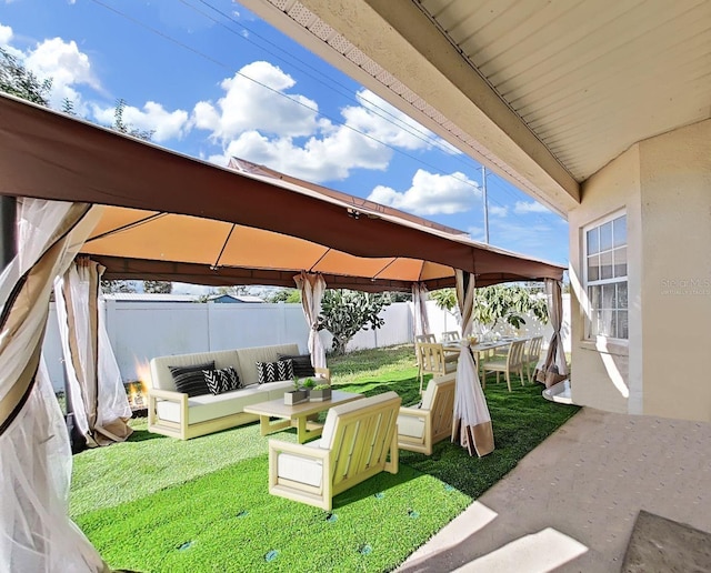 view of yard with a gazebo, outdoor lounge area, and a patio