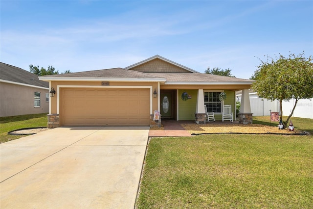 view of front facade with a garage and a front lawn