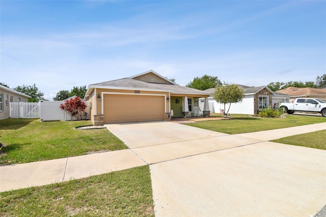 ranch-style home with a garage and a front yard