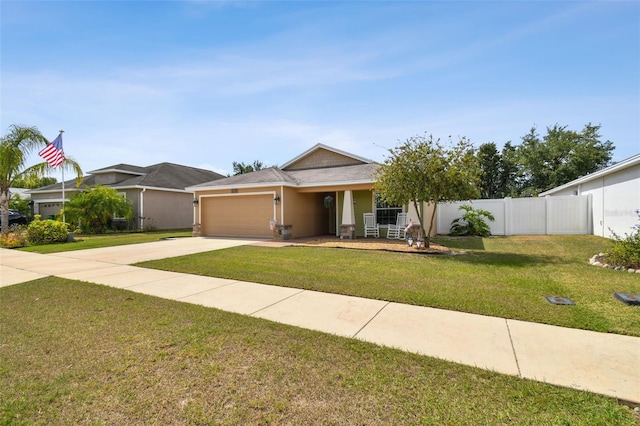 view of front facade featuring a front yard and a garage