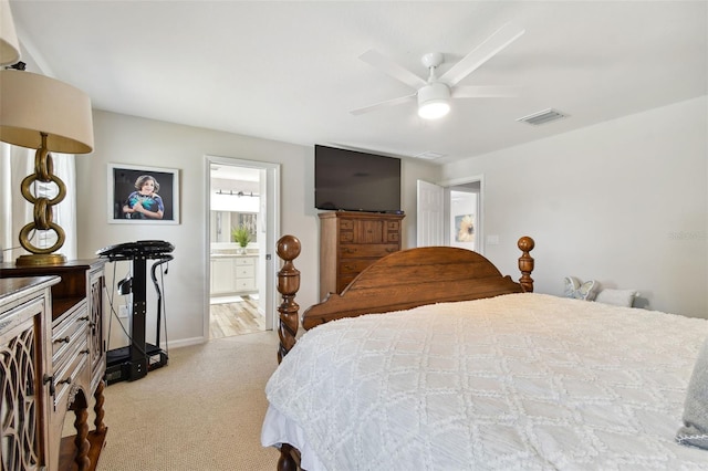 carpeted bedroom with ceiling fan and connected bathroom