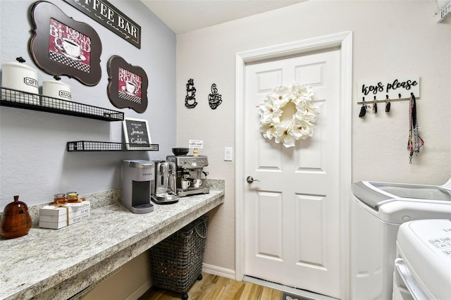 interior space featuring separate washer and dryer and hardwood / wood-style flooring