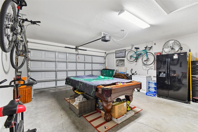 game room with a textured ceiling, concrete flooring, and pool table