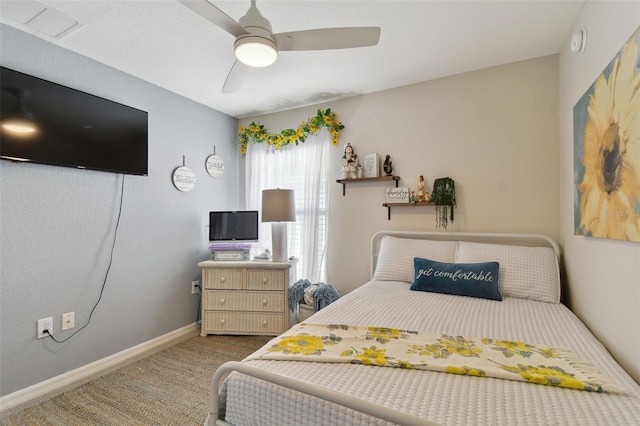 bedroom with ceiling fan and carpet