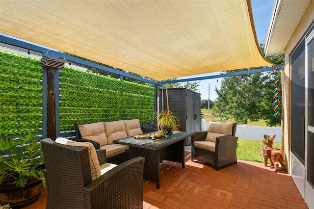 view of patio with a storage unit and an outdoor hangout area