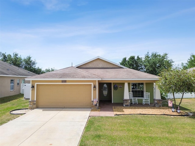 view of front of home featuring a front yard and a garage