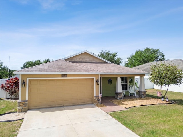 ranch-style home featuring a garage and a front yard